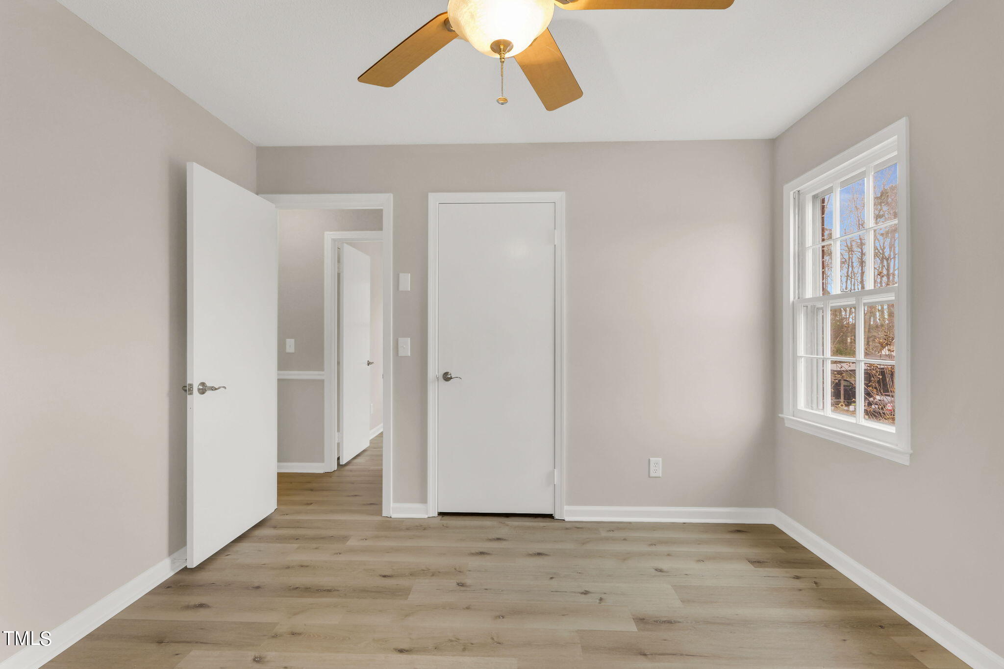 1073 Brick Mill Road Coats, NC 27521 - Photo 18 of 32 a view of an empty room with wooden floor and a window