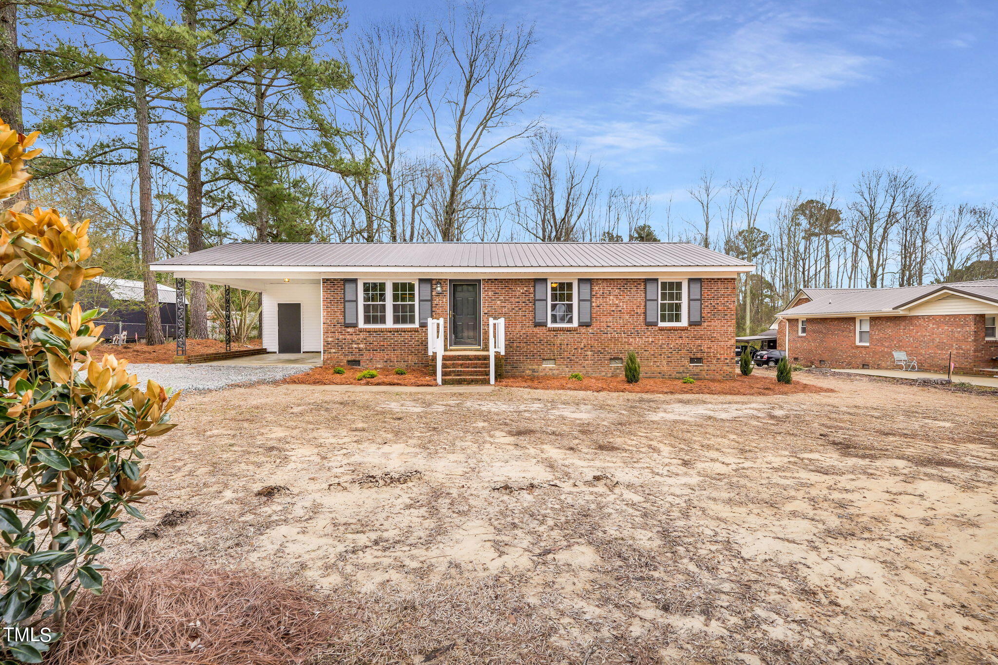 1073 Brick Mill Road Coats, NC 27521 - Photo 2 of 32 a front view of a house with a yard
