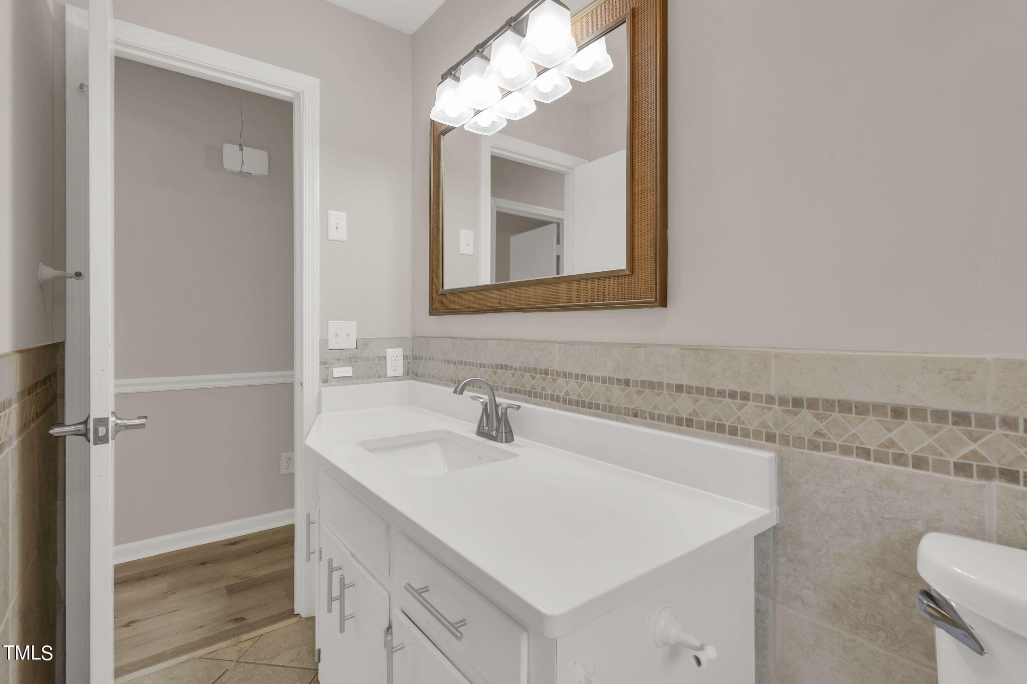 1073 Brick Mill Road Coats, NC 27521 - Photo 22 of 32 a bathroom with a sink vanity and mirror