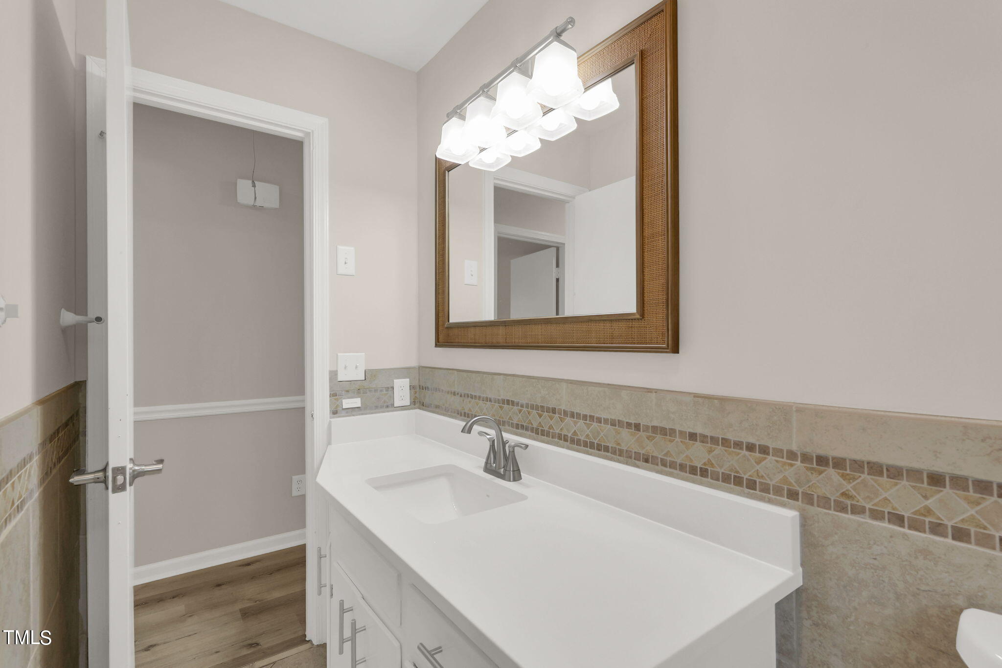1073 Brick Mill Road Coats, NC 27521 - Photo 24 of 32 a bathroom with a sink and a mirror