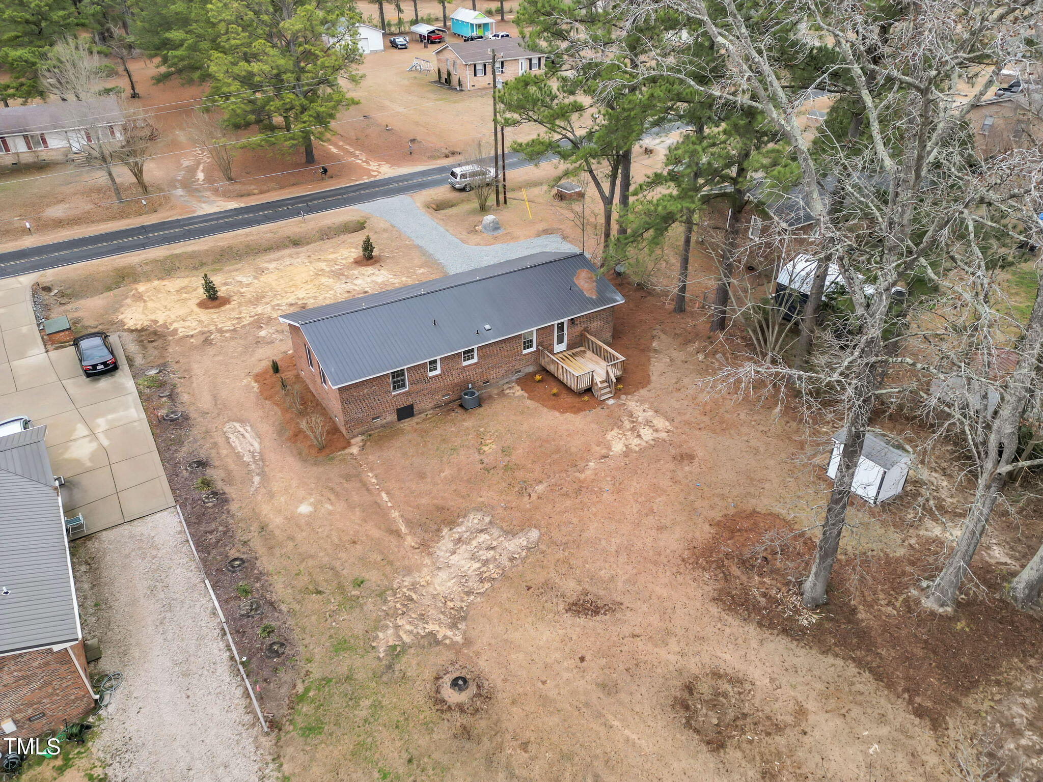 1073 Brick Mill Road Coats, NC 27521 - Photo 29 of 32 a view of a backyard with a tree