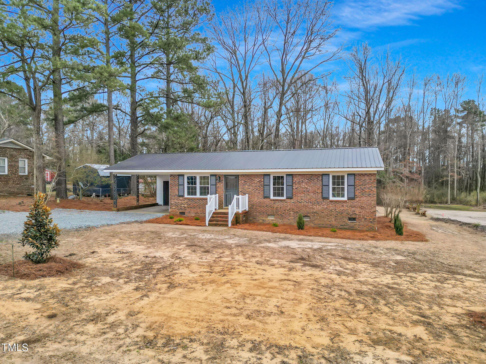 1073 Brick Mill Road Coats, NC 27521 - Photo 30 of 32 a front view of a house with yard