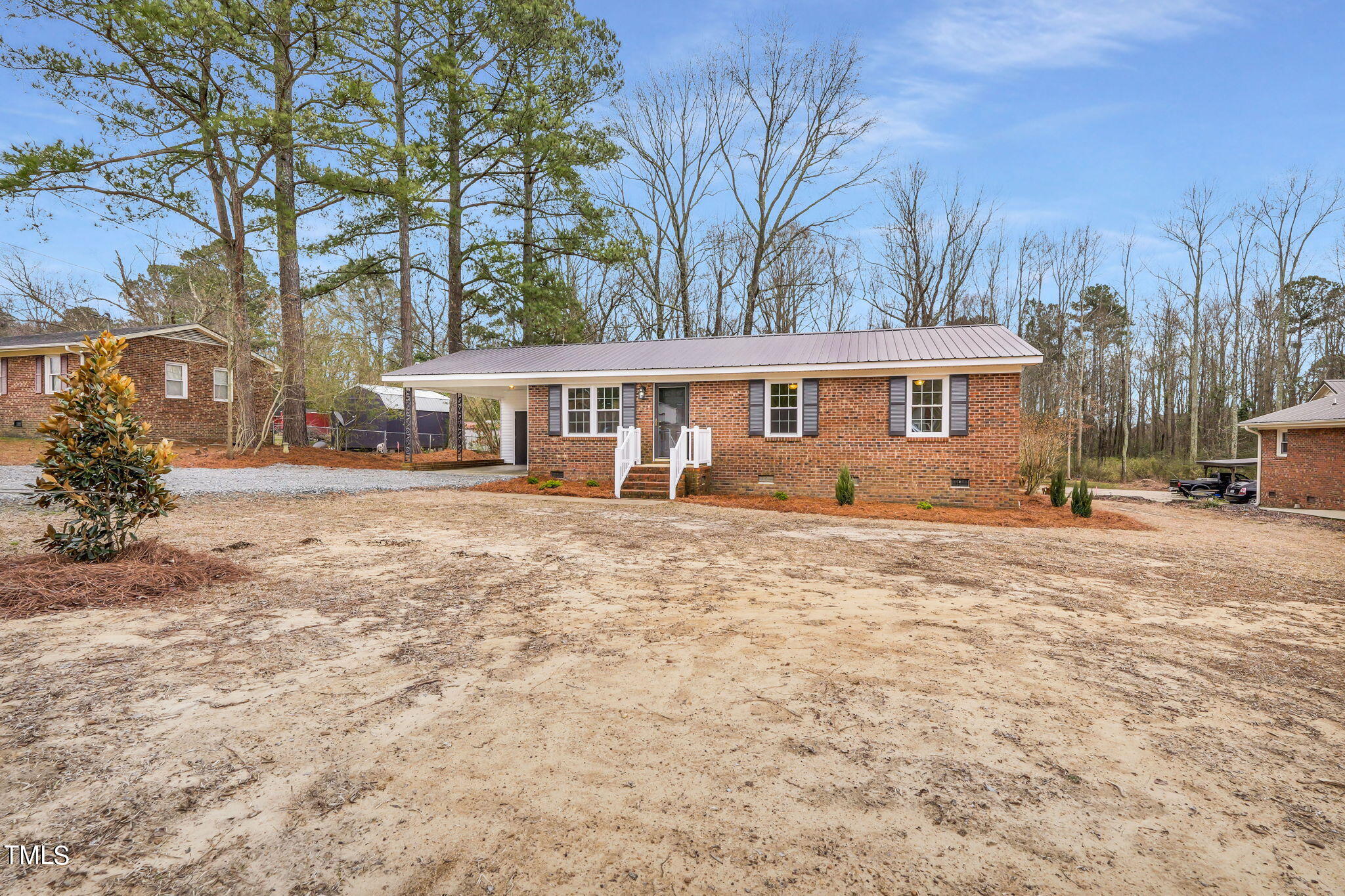 1073 Brick Mill Road Coats, NC 27521 - Photo 3 of 32 a front view of a house with a yard