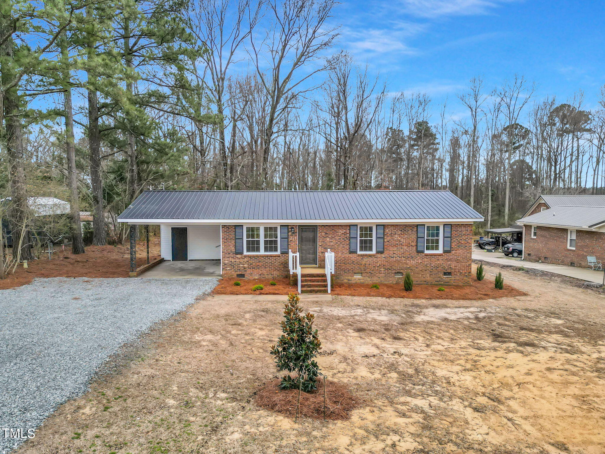 1073 Brick Mill Road Coats, NC 27521 - Photo 31 of 32 a front view of a house with garden