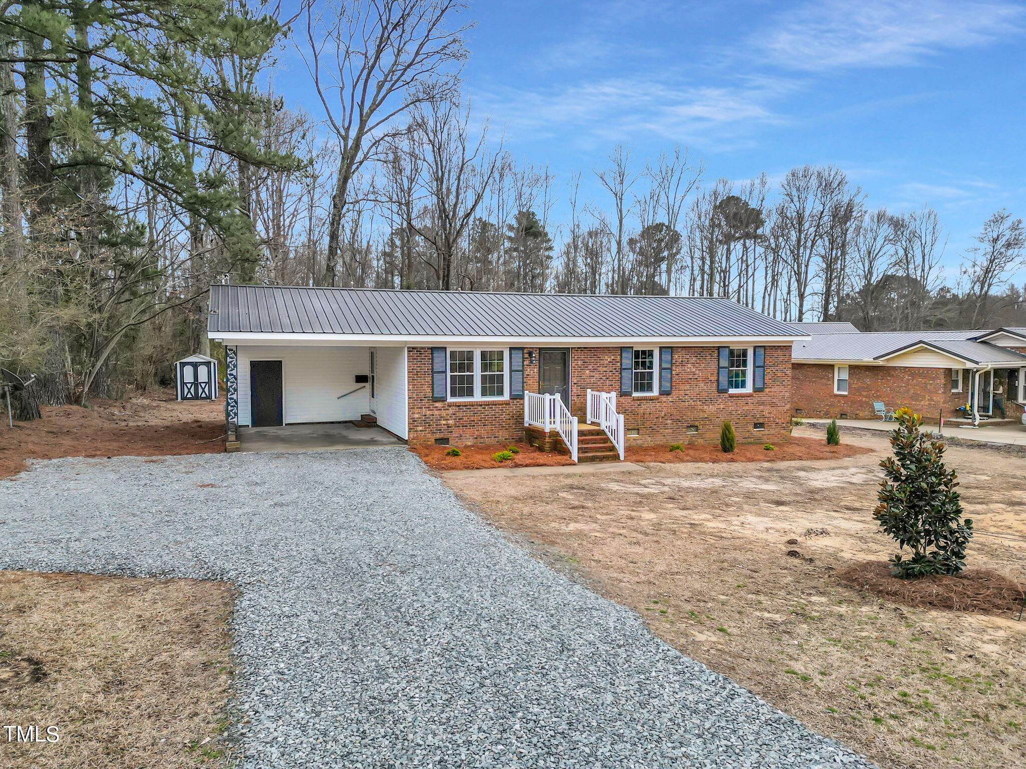 1073 Brick Mill Road Coats, NC 27521 - Photo 32 of 32 front view of a house with a yard