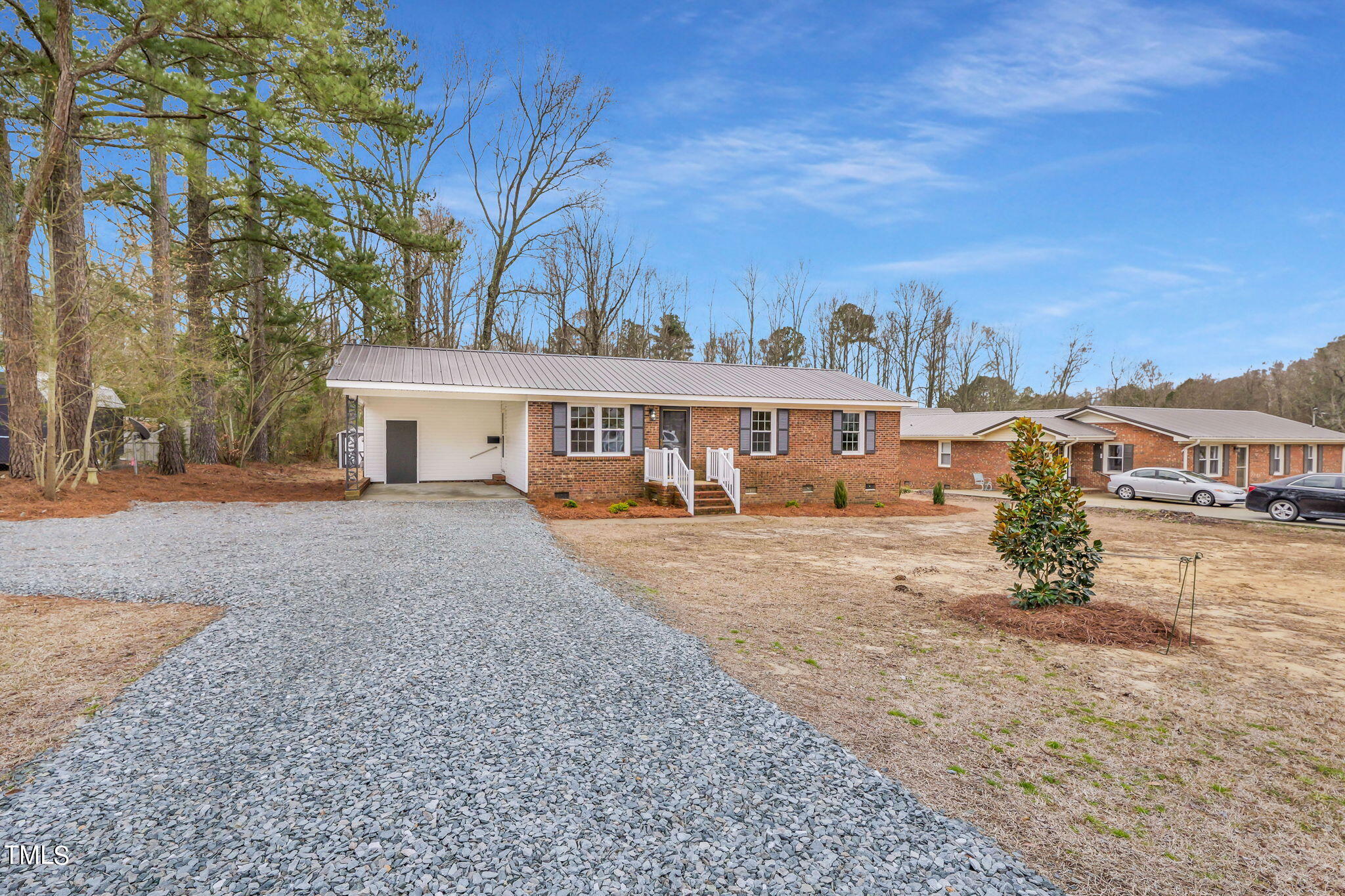 1073 Brick Mill Road Coats, NC 27521 - Photo 4 of 32 front view of a house with a yard