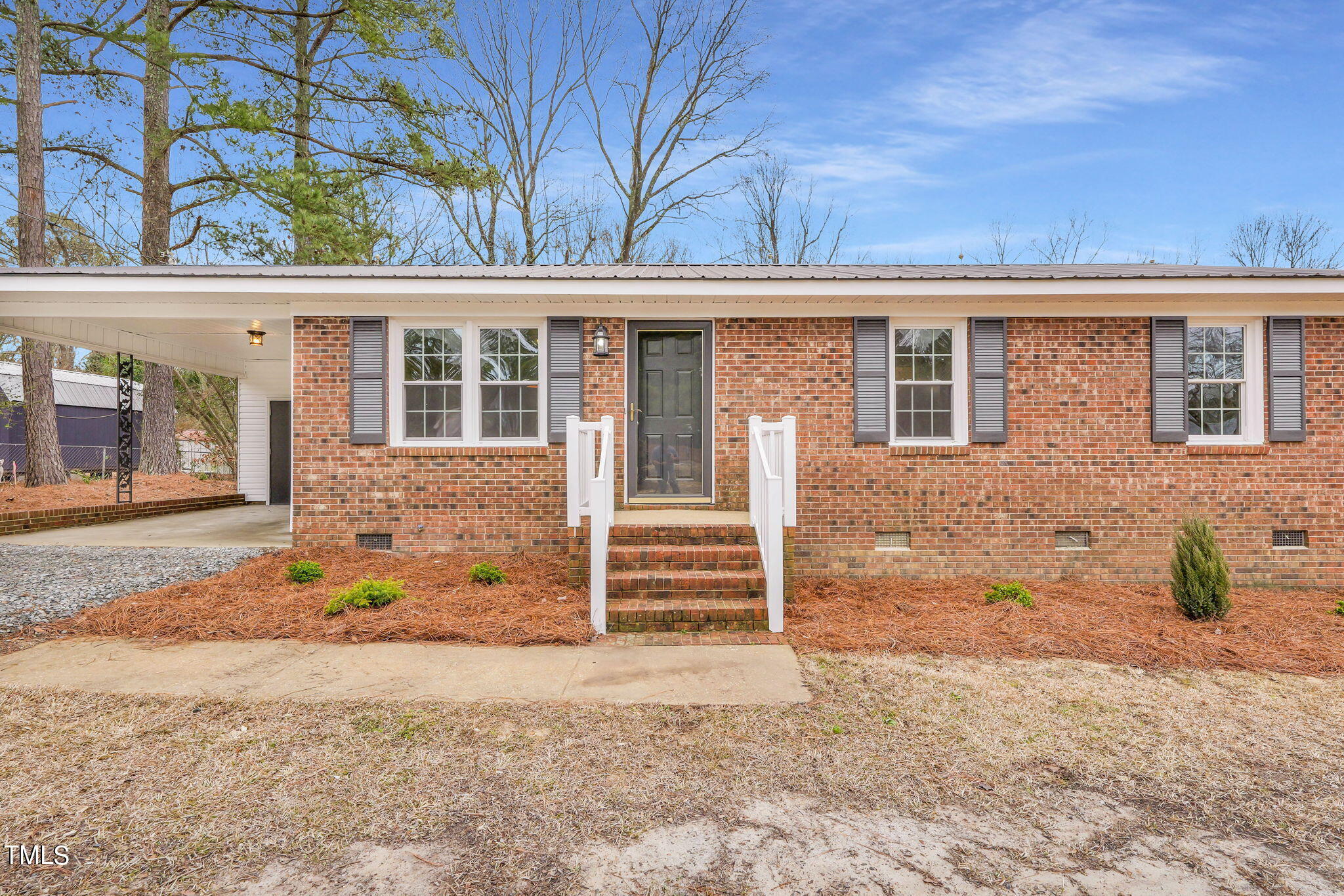 1073 Brick Mill Road Coats, NC 27521 - Photo 6 of 32 front view of a house with a yard