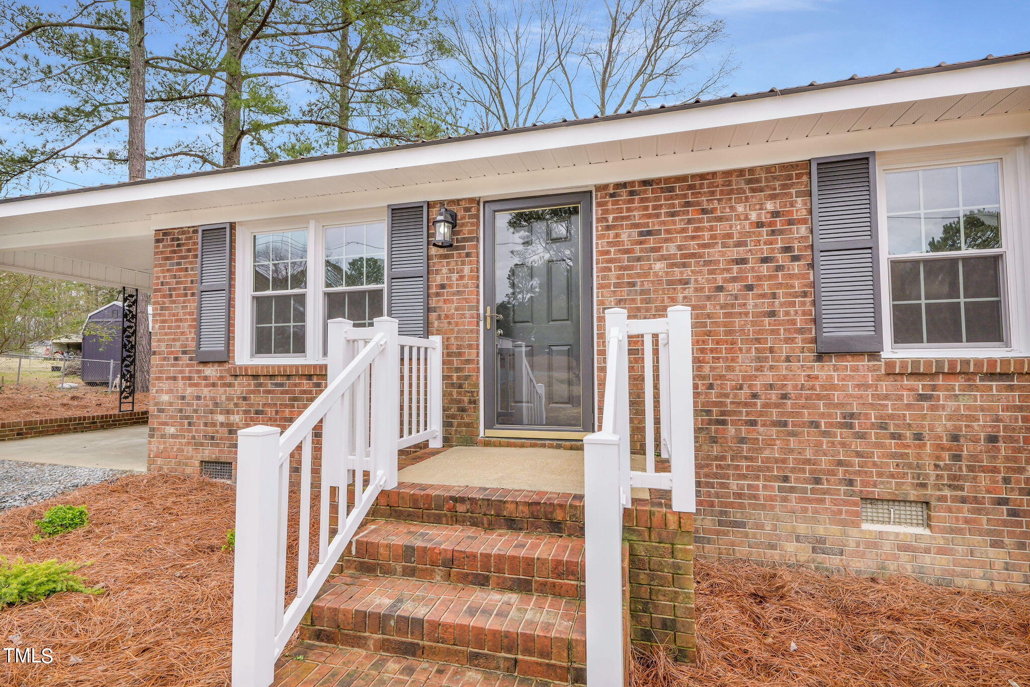 1073 Brick Mill Road Coats, NC 27521 - Photo 7 of 32 a front view of a house with a porch