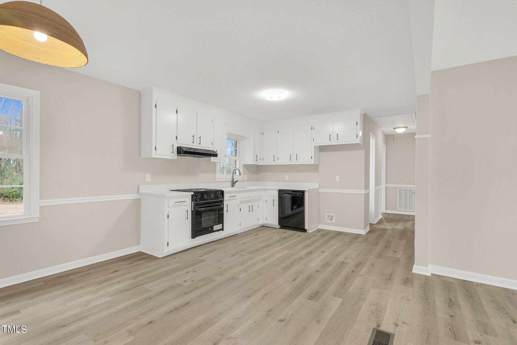 1073 Brick Mill Road Coats, NC 27521 - Photo 9 of 32 a view of kitchen with granite countertop cabinets and wooden floor