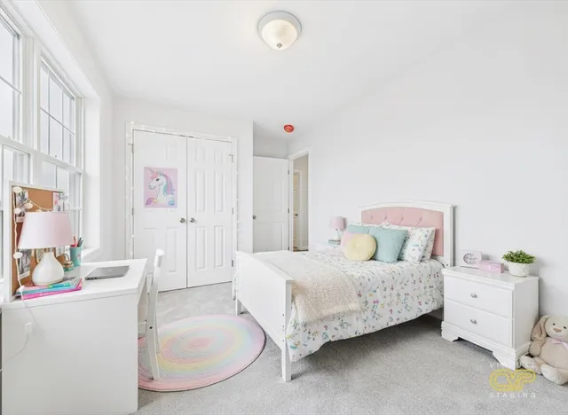 a room with furniture and a baby crib