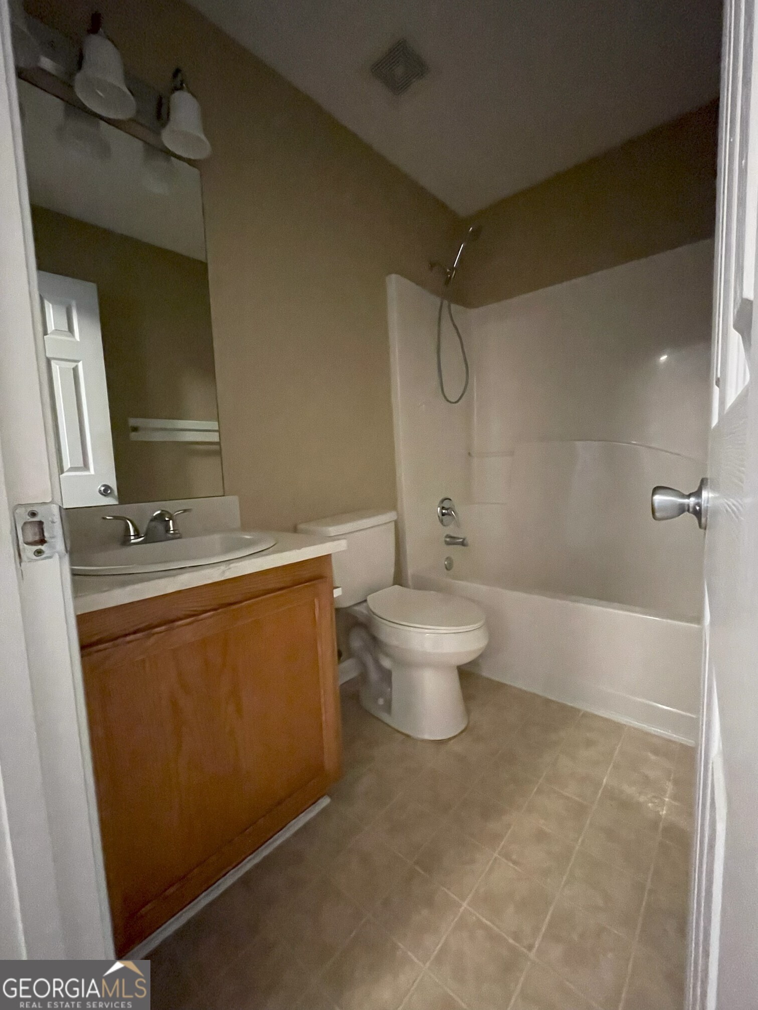 134 Cemetary Road Luthersville, GA 30251 - Photo 5 of 18 a bathroom with a toilet a sink and mirror