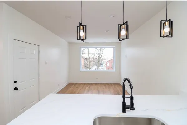 a bathroom with a sink and a window