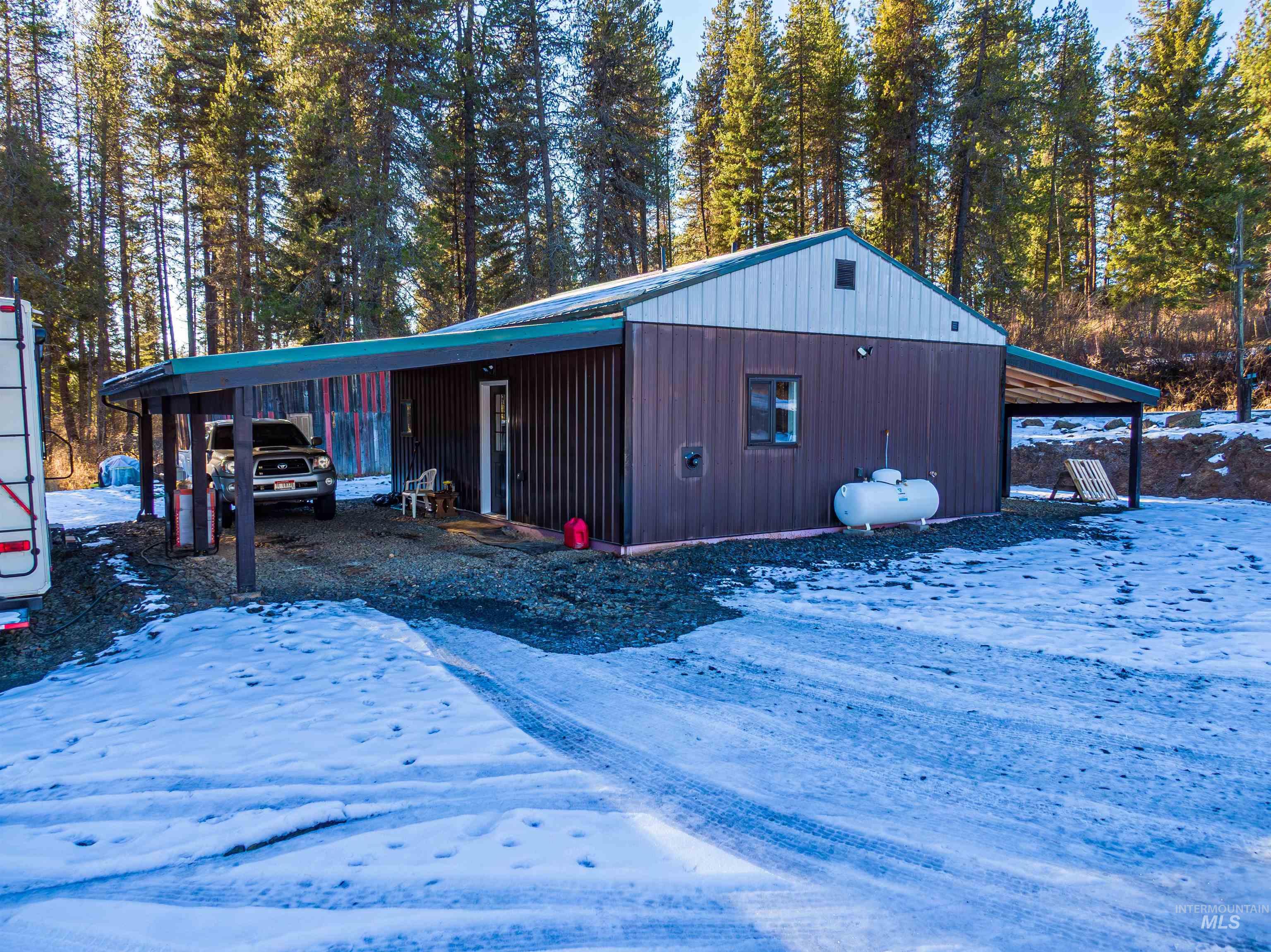 1112 Old Pk Road Deary, ID 83823 - Photo 5 of 23 Snow covered structure with a carport
