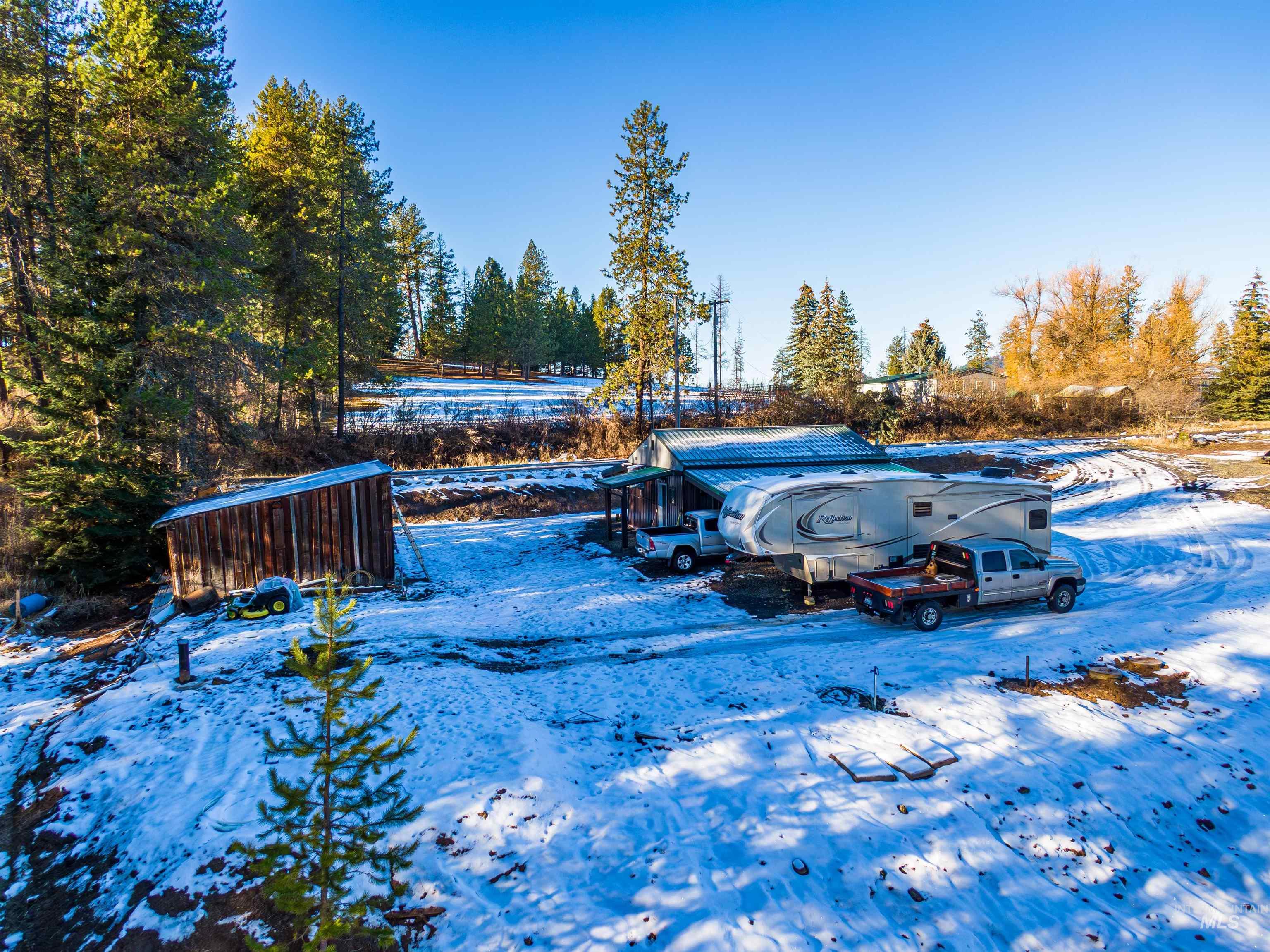 1112 Old Pk Road Deary, ID 83823 - Photo 9 of 23 Yard covered in snow with view of scattered trees