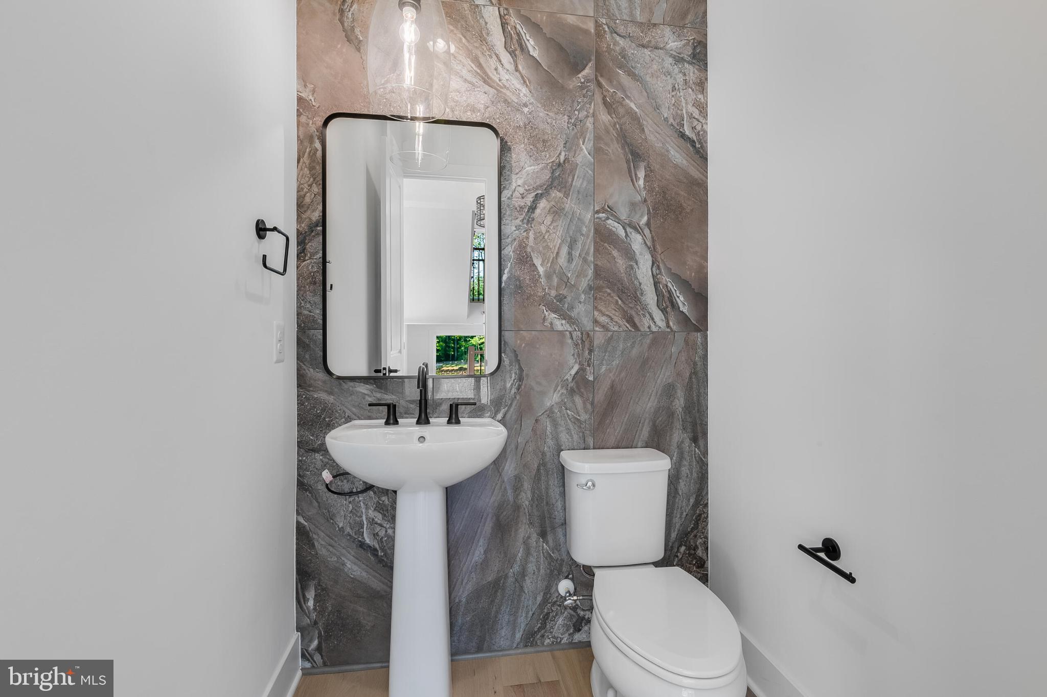 9209 Franks Point Lane Lorton, VA 22079 - Photo 23 of 33 Sleek modern bathroom with elegant finishes.