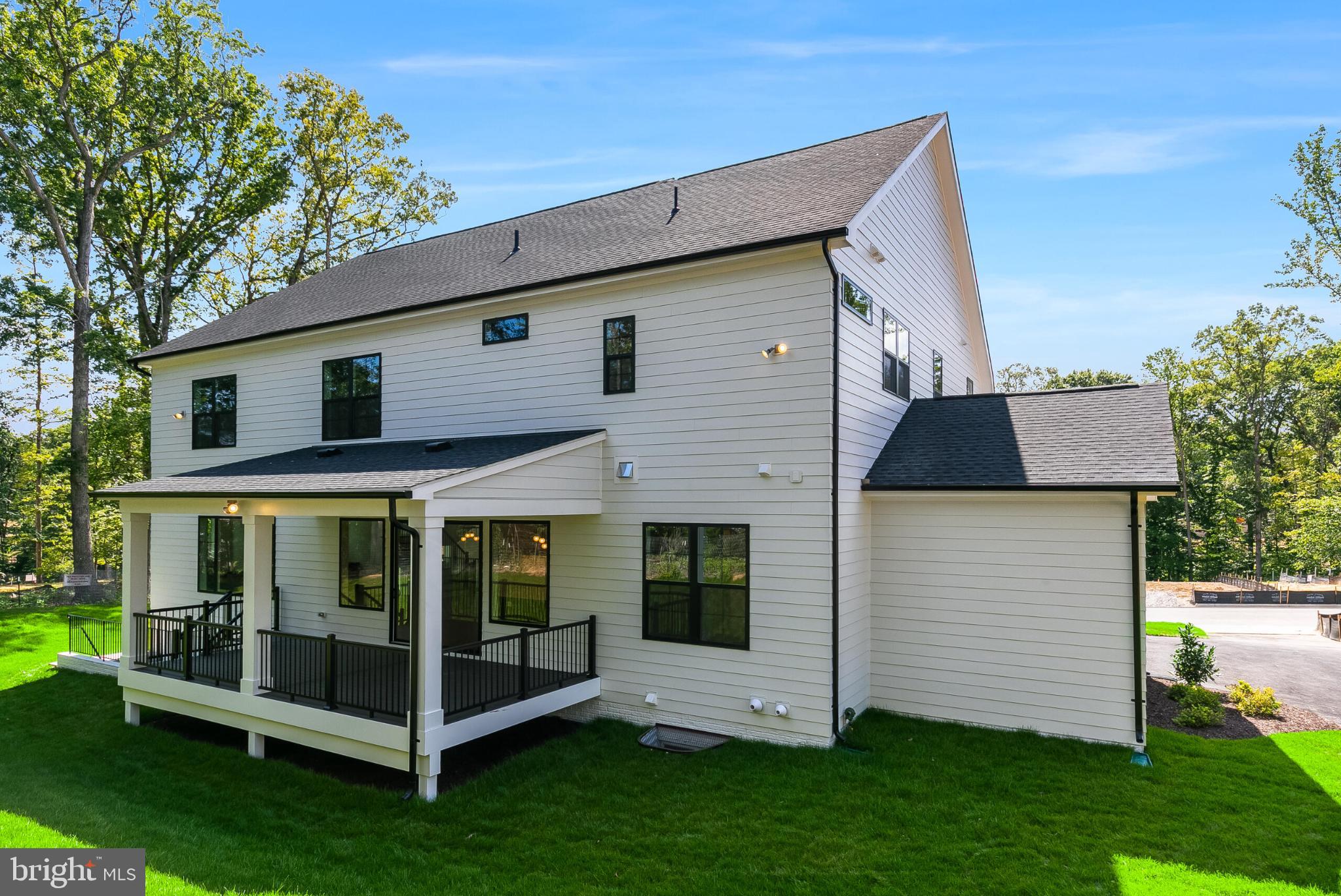 9209 Franks Point Lane Lorton, VA 22079 - Photo 5 of 16 a front view of a house with a garden
