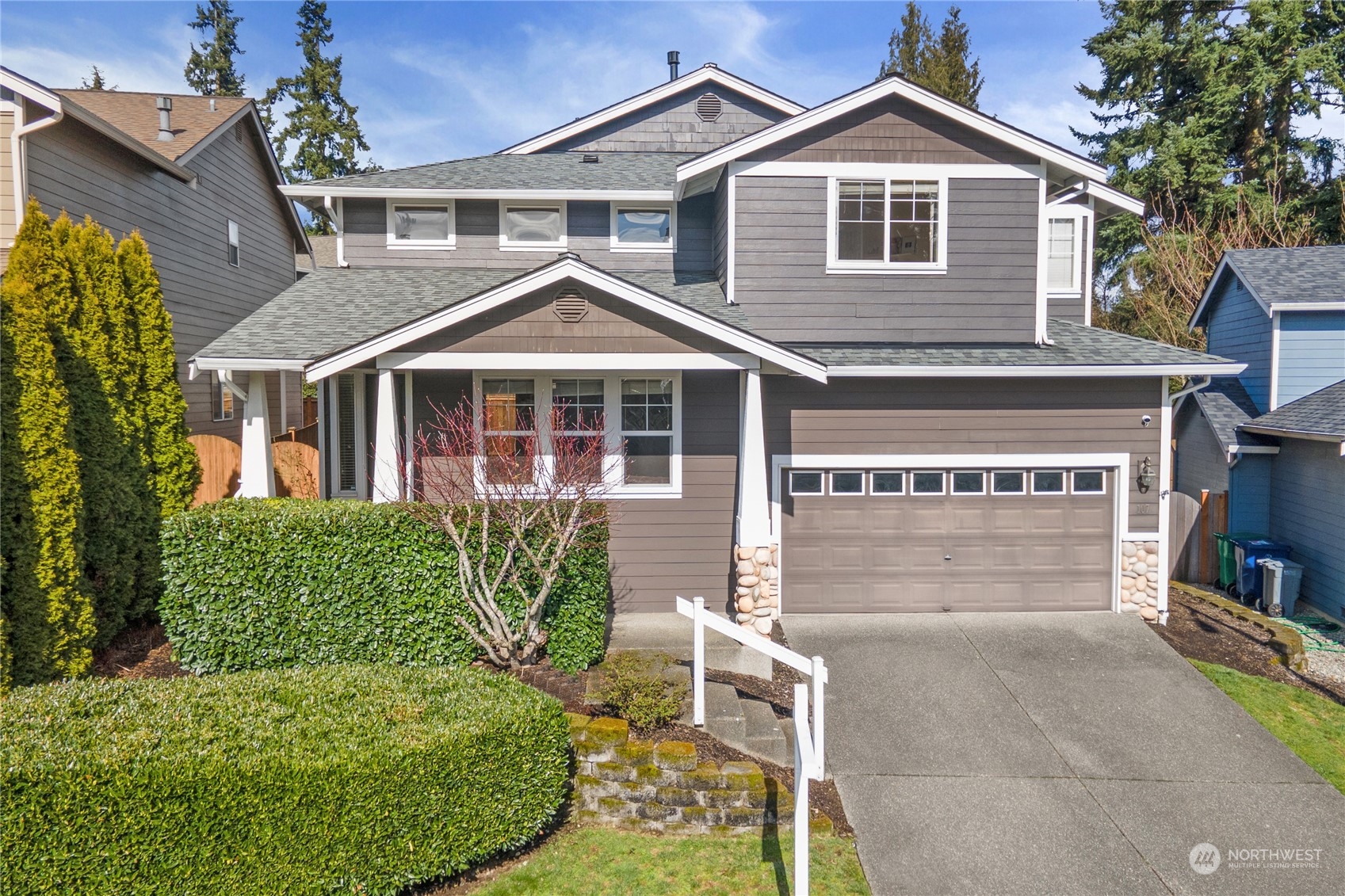 107 202nd Street Southeast Bothell, WA 98012 - Photo 2 of 34 a front view of a house with a garden