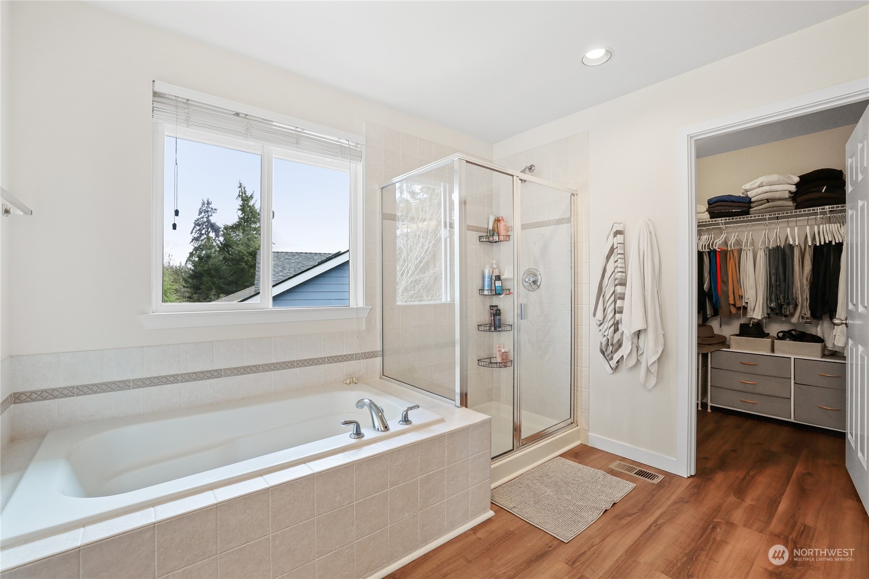 107 202nd Street Southeast Bothell, WA 98012 - Photo 21 of 34 a bathroom with a tub a sink and a large mirror
