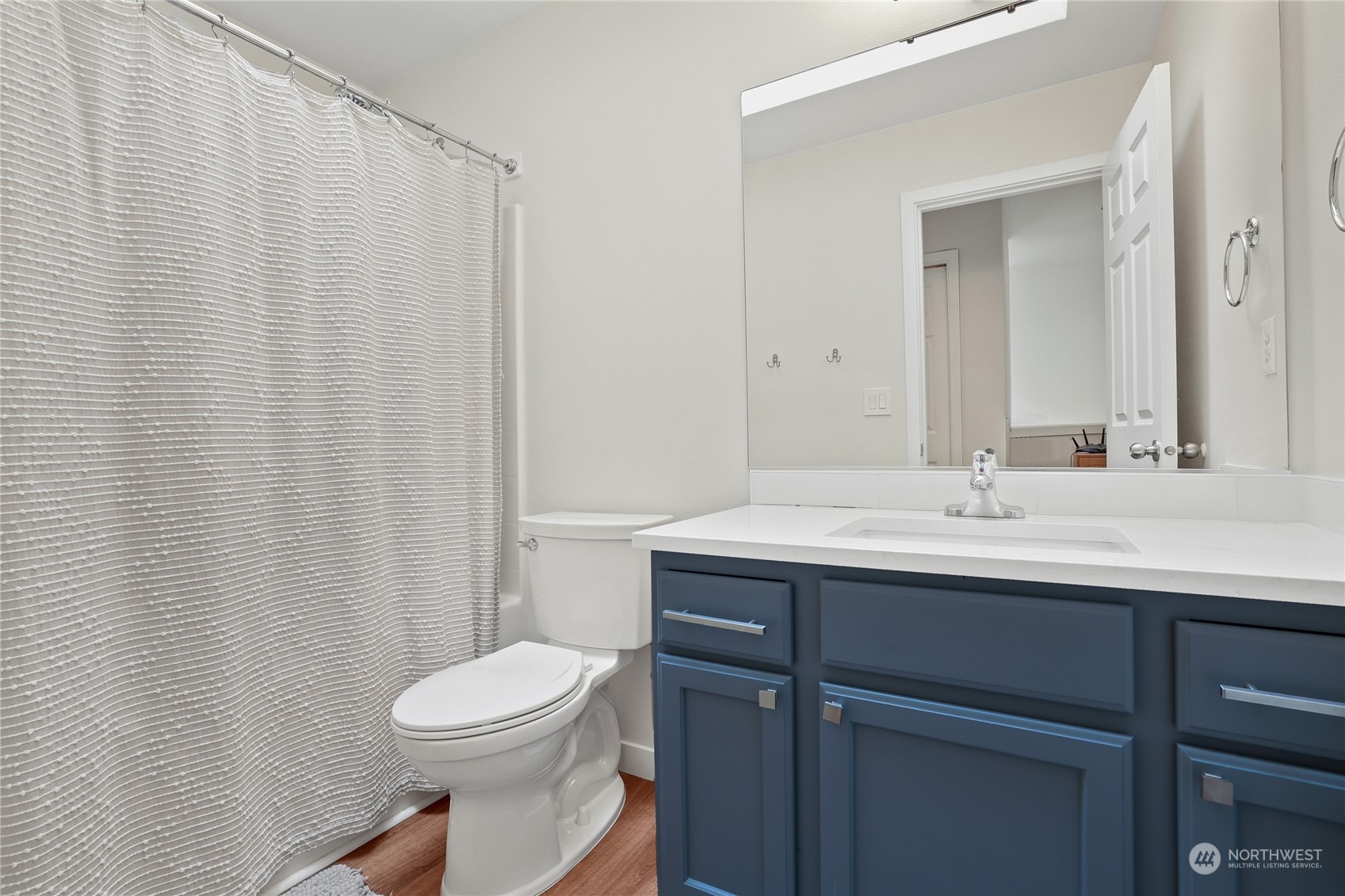 107 202nd Street Southeast Bothell, WA 98012 - Photo 25 of 34 a bathroom with a sink a toilet and shower curtain