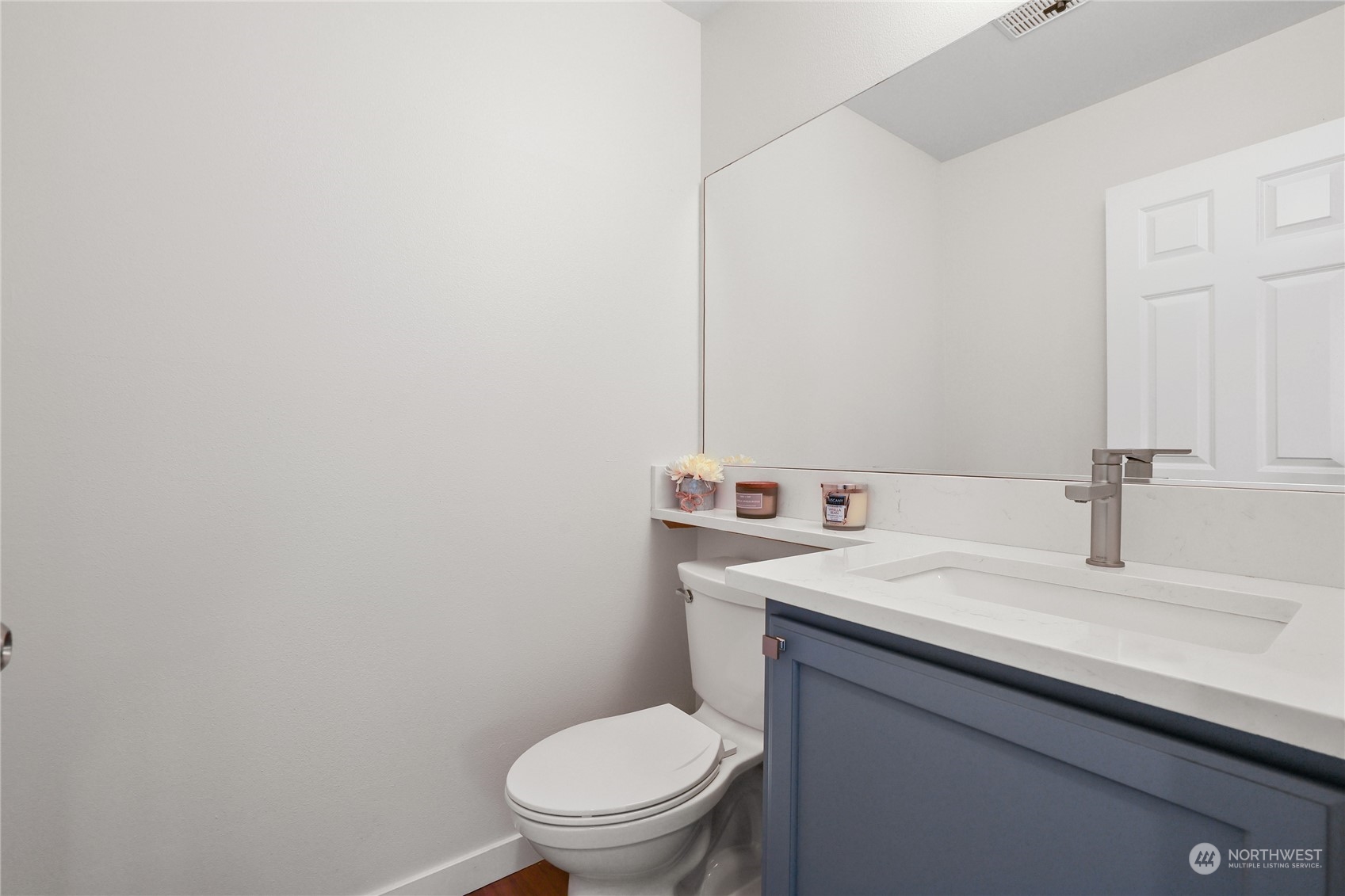 107 202nd Street Southeast Bothell, WA 98012 - Photo 9 of 34 a bathroom with a sink a toilet and mirror