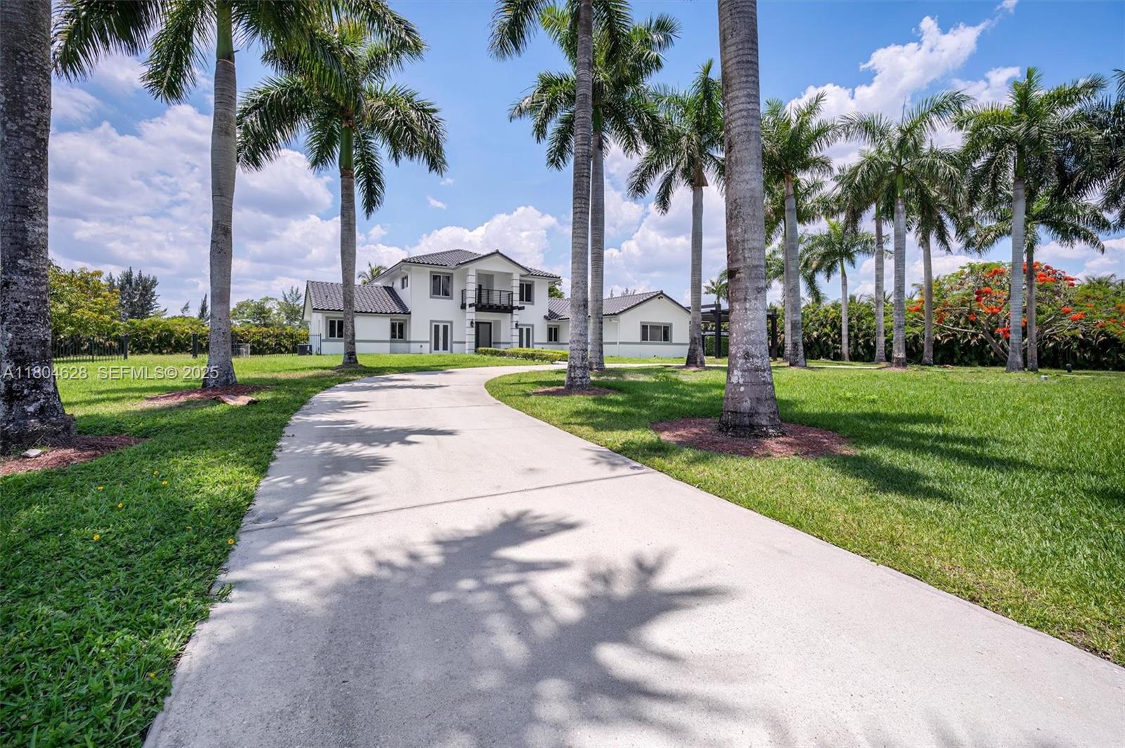 5121 Southwest 210th Terrace Southwest Ranches, FL 33332 - Photo 1 of 70 a view of a park with a palm trees