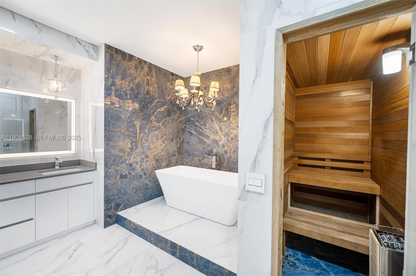 5121 Southwest 210th Terrace Southwest Ranches, FL 33332 - Photo 20 of 70 a bathroom with a sink and a mirror