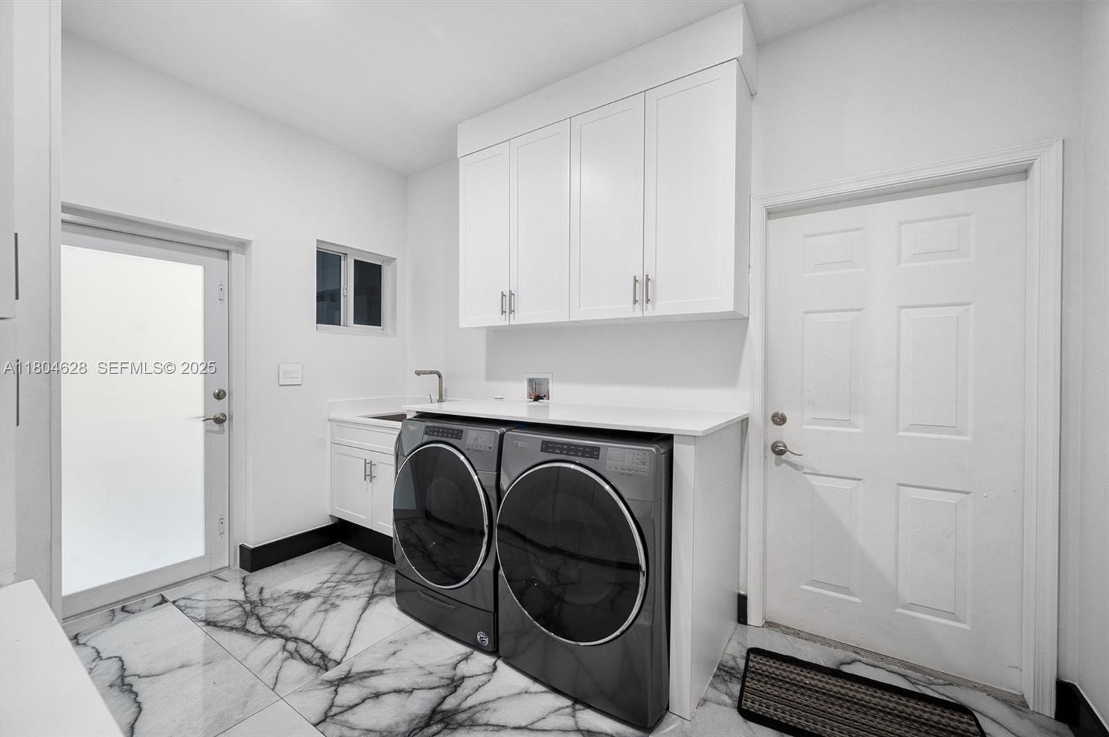 5121 Southwest 210th Terrace Southwest Ranches, FL 33332 - Photo 26 of 70 a utility room with dryer and washer