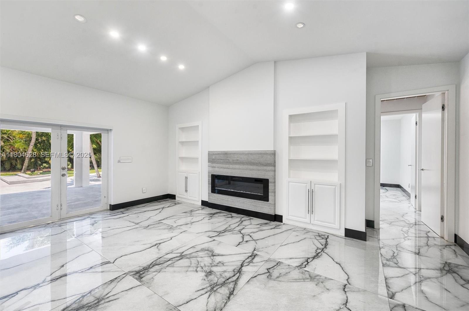 5121 Southwest 210th Terrace Southwest Ranches, FL 33332 - Photo 28 of 70 a view of a livingroom with a fireplace