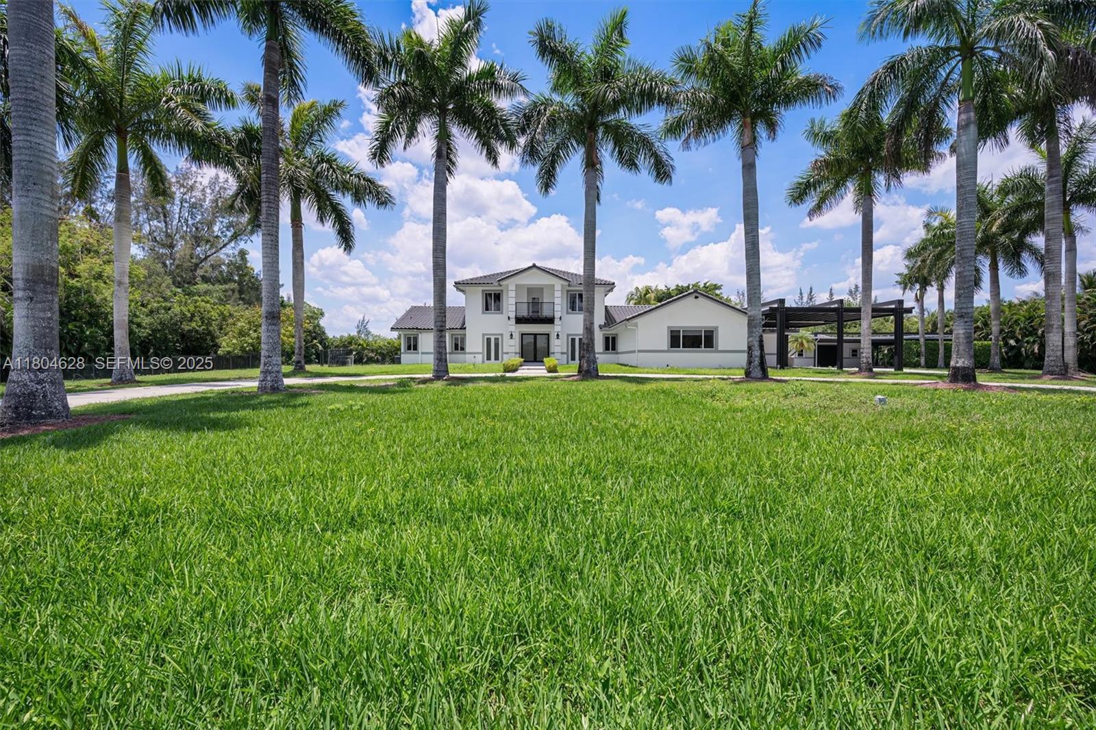 5121 Southwest 210th Terrace Southwest Ranches, FL 33332 - Photo 3 of 70 a view of a park with palm trees