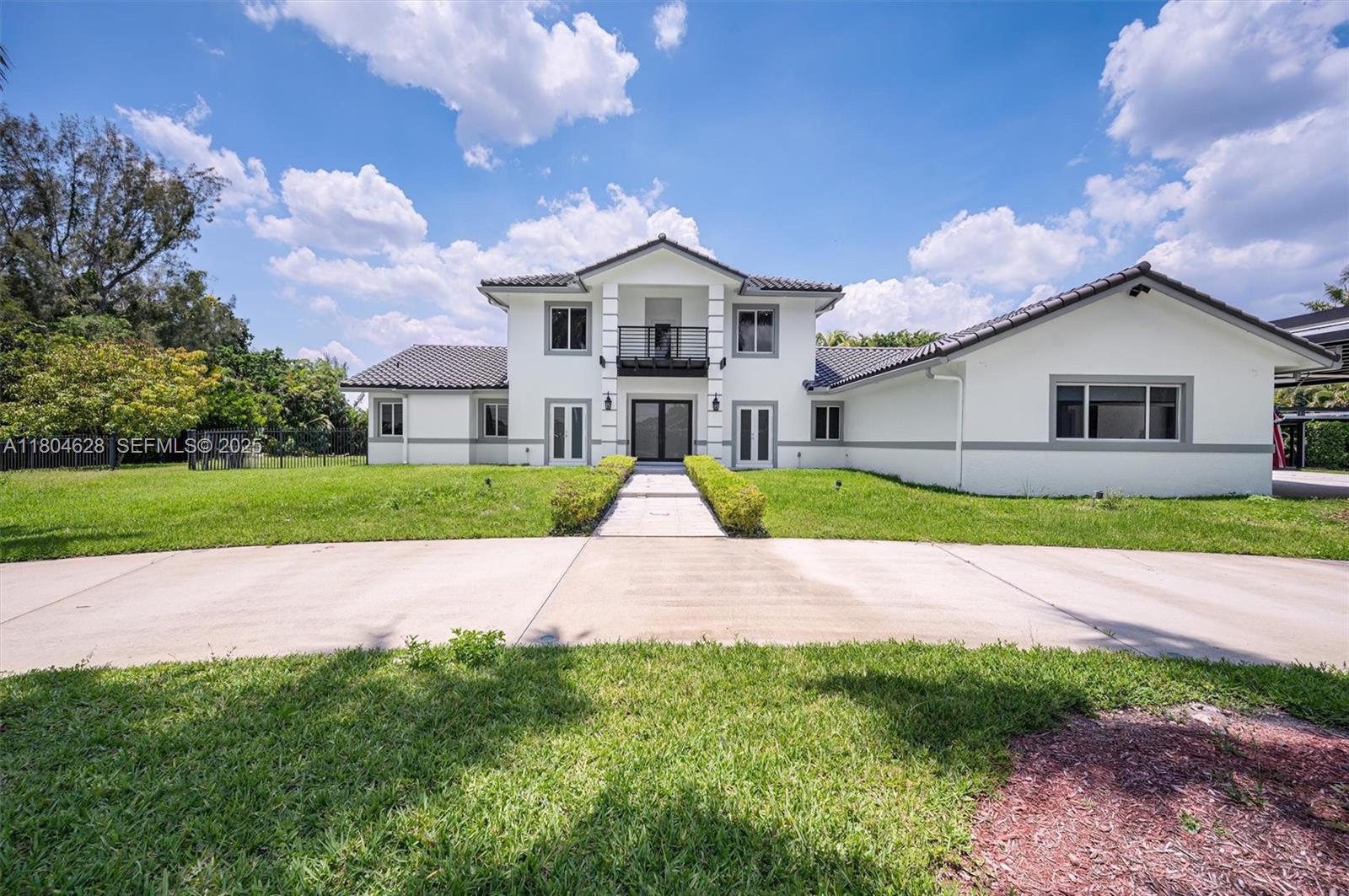 5121 Southwest 210th Terrace Southwest Ranches, FL 33332 - Photo 4 of 70 a house with garden in front of it