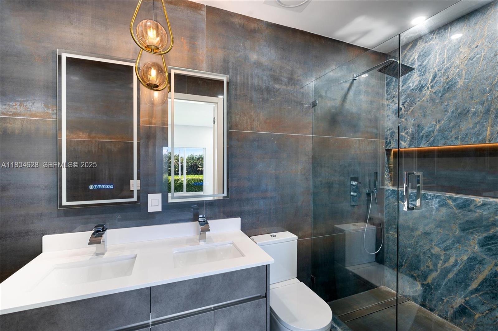 5121 Southwest 210th Terrace Southwest Ranches, FL 33332 - Photo 41 of 70 a bathroom with a sink toilet and shower