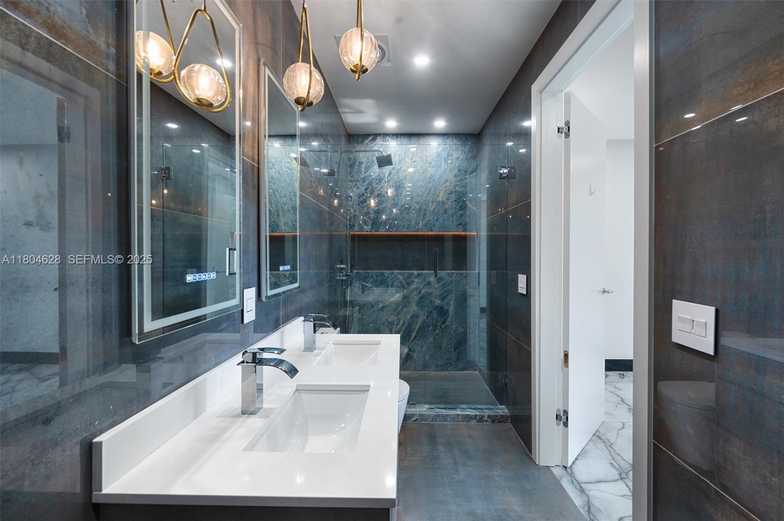 5121 Southwest 210th Terrace Southwest Ranches, FL 33332 - Photo 42 of 70 a bathroom with a sink a toilet and shower