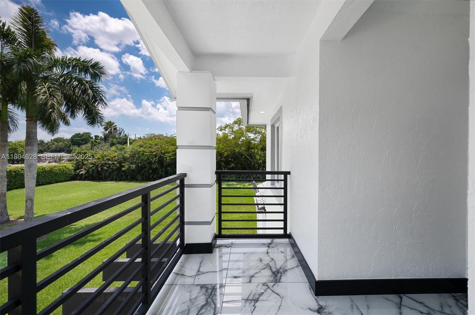 5121 Southwest 210th Terrace Southwest Ranches, FL 33332 - Photo 44 of 70 a view of a garden with a bench in the patio