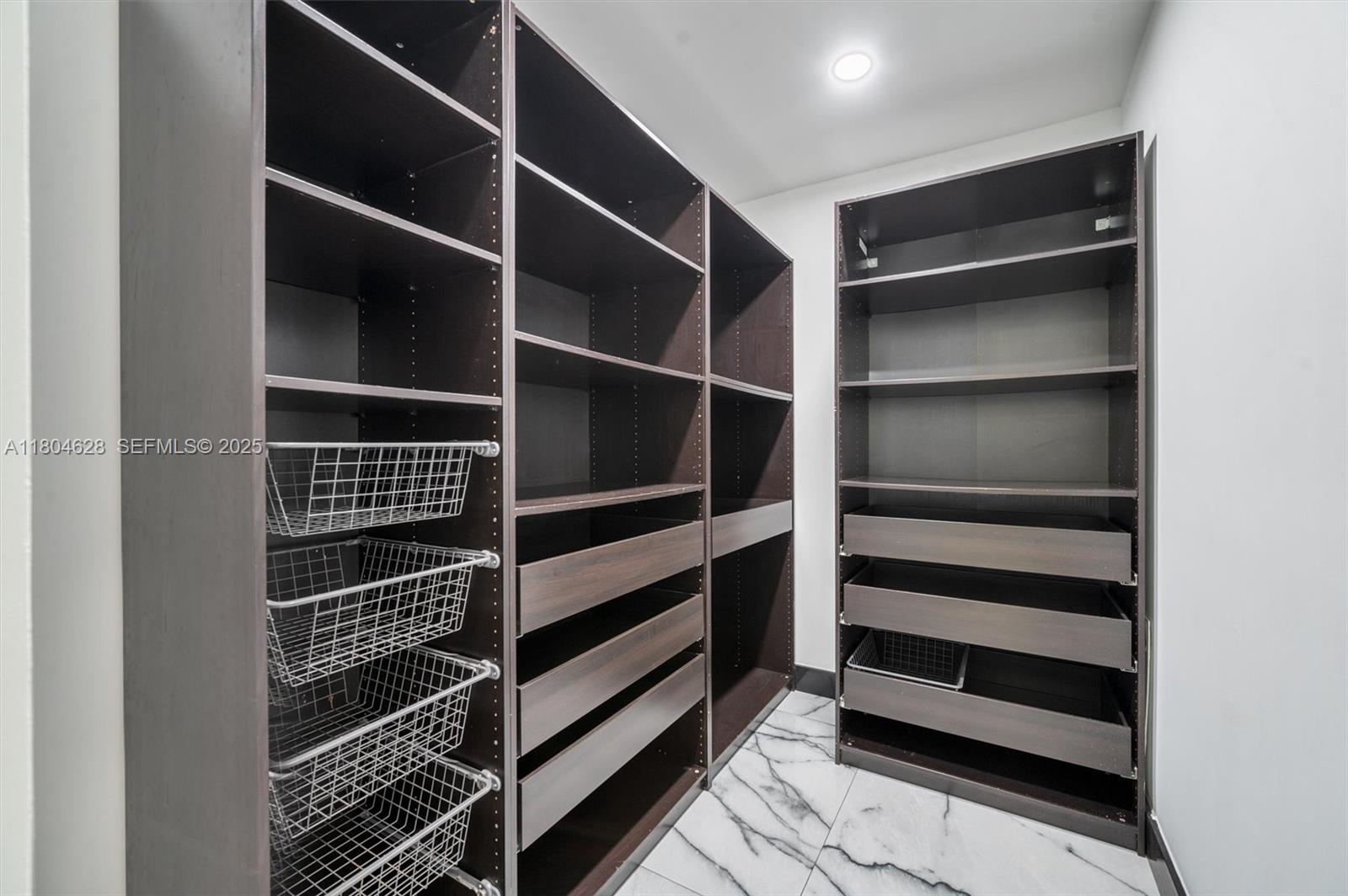 5121 Southwest 210th Terrace Southwest Ranches, FL 33332 - Photo 49 of 70 a view of walk in closet with empty racks