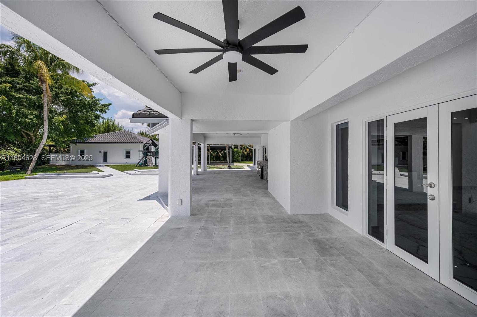 5121 Southwest 210th Terrace Southwest Ranches, FL 33332 - Photo 54 of 70 a view of a livingroom with a flat screen tv
