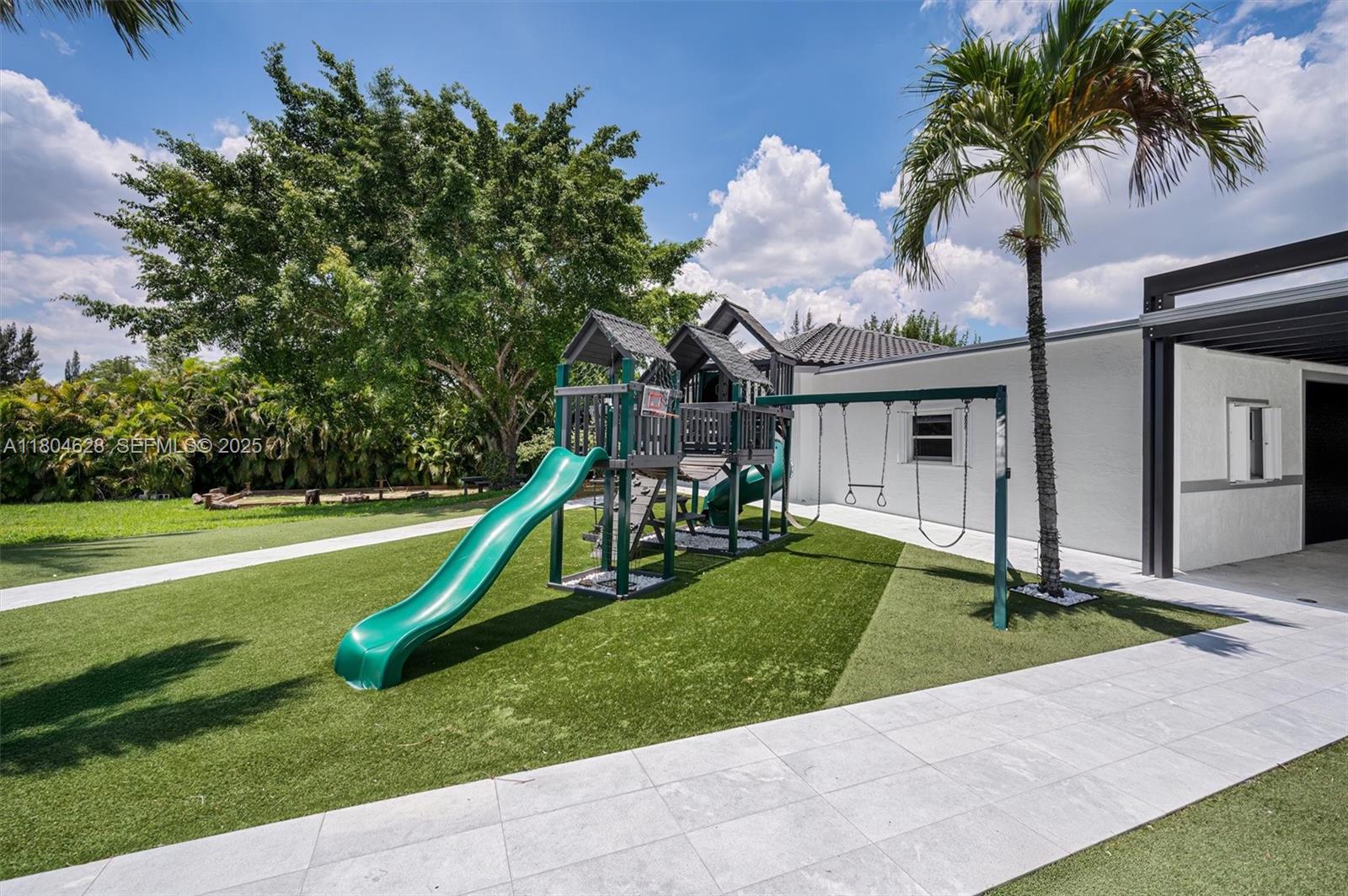 5121 Southwest 210th Terrace Southwest Ranches, FL 33332 - Photo 60 of 70 a view of a house with a swimming pool and a yard