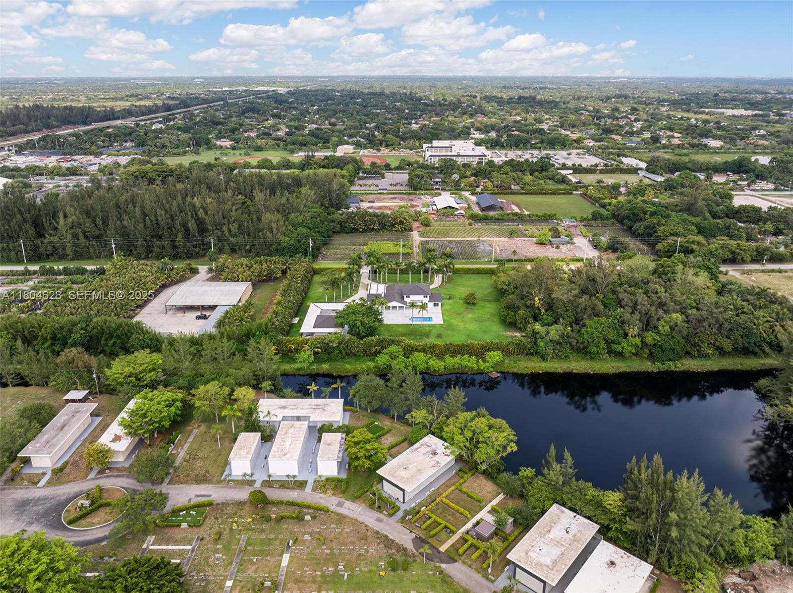 5121 Southwest 210th Terrace Southwest Ranches, FL 33332 - Photo 68 of 70 an aerial view of residential houses with outdoor space and river