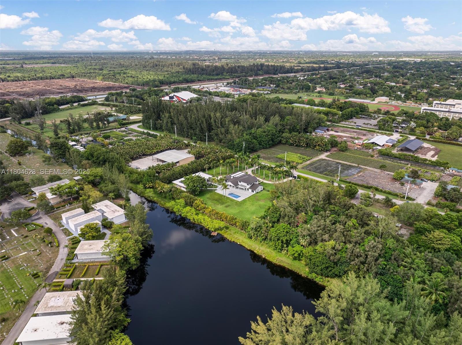 5121 Southwest 210th Terrace Southwest Ranches, FL 33332 - Photo 69 of 70 an aerial view of residential houses with outdoor space and river
