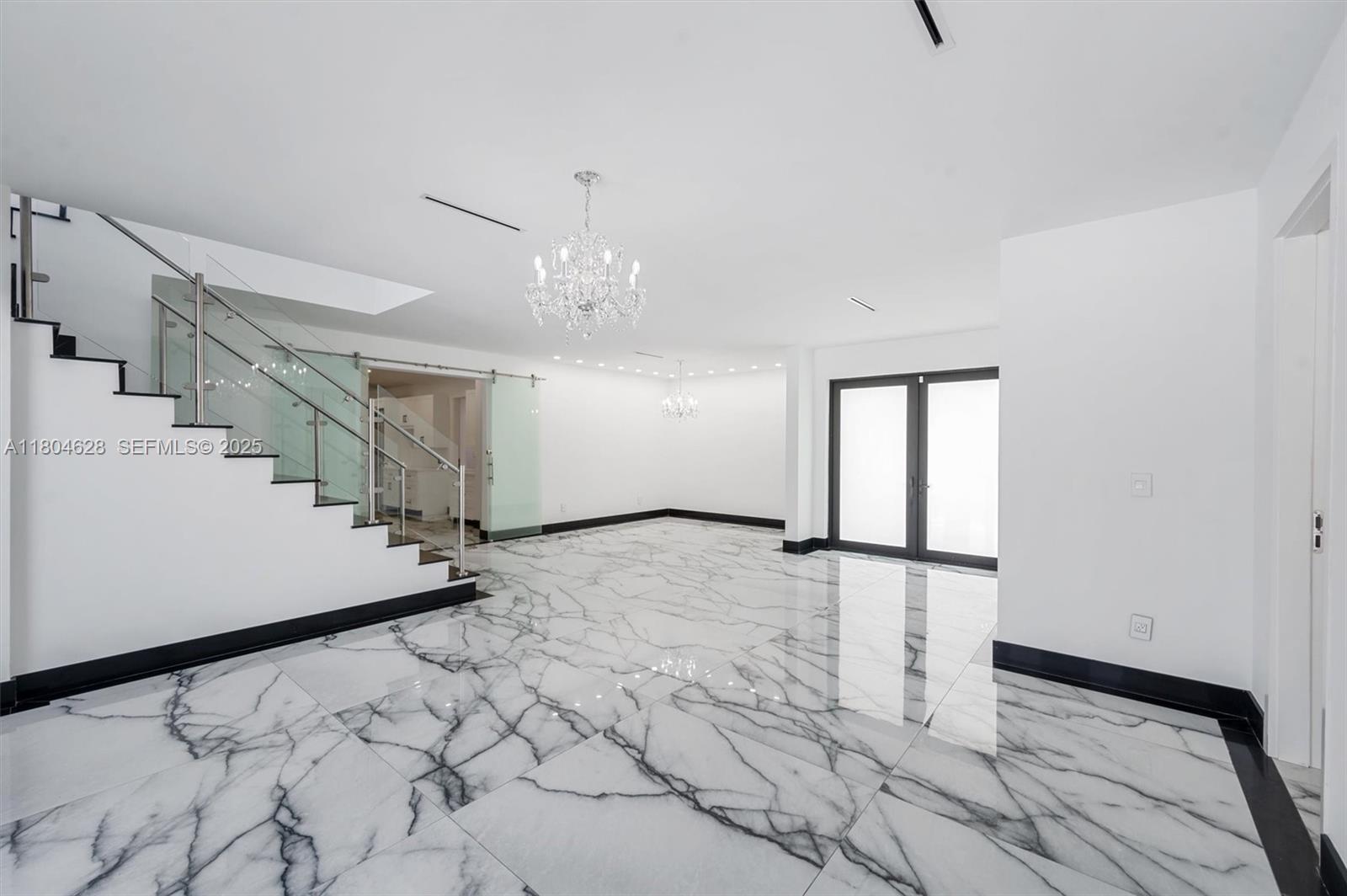 5121 Southwest 210th Terrace Southwest Ranches, FL 33332 - Photo 9 of 70 a view of a livingroom with wooden floor and stairs