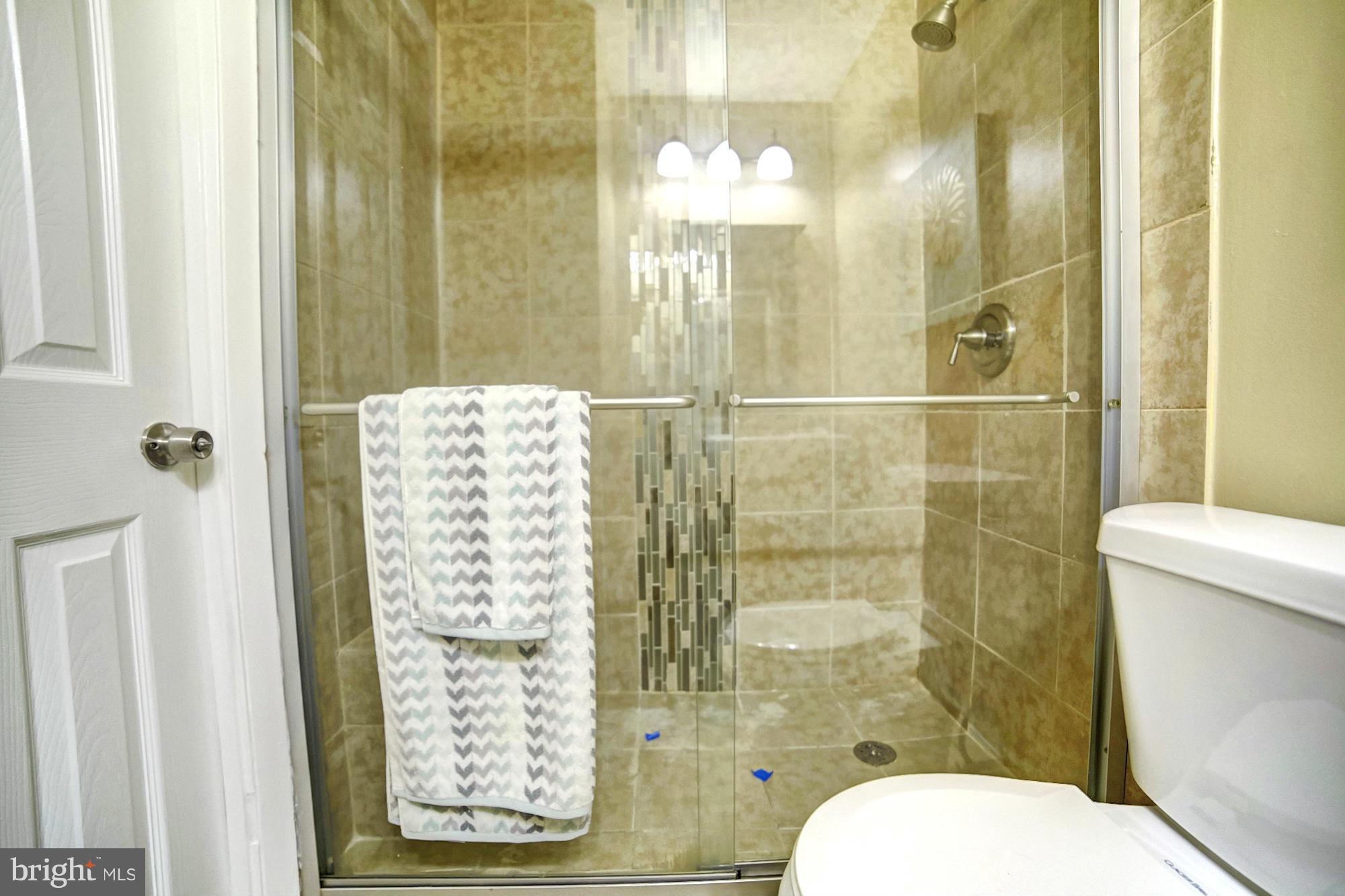 8248 Vosges Road Baltimore, MD 21244 - Photo 17 of 23 Tile Shower and Glass Door