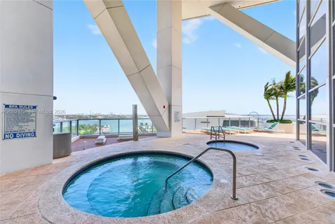 a view of a swimming pool with a lounge chair