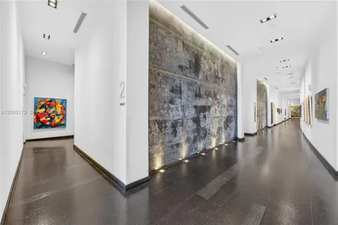 a view of a hallway view with wooden floor and staircase