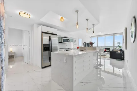 a kitchen with counter top space and appliances