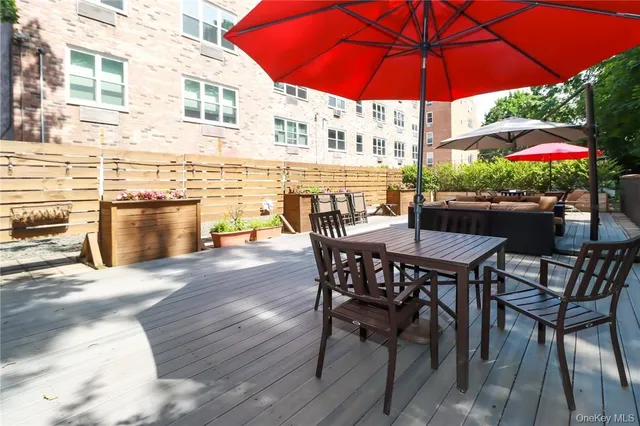 a patio with a patio table and chairs under an umbrella
