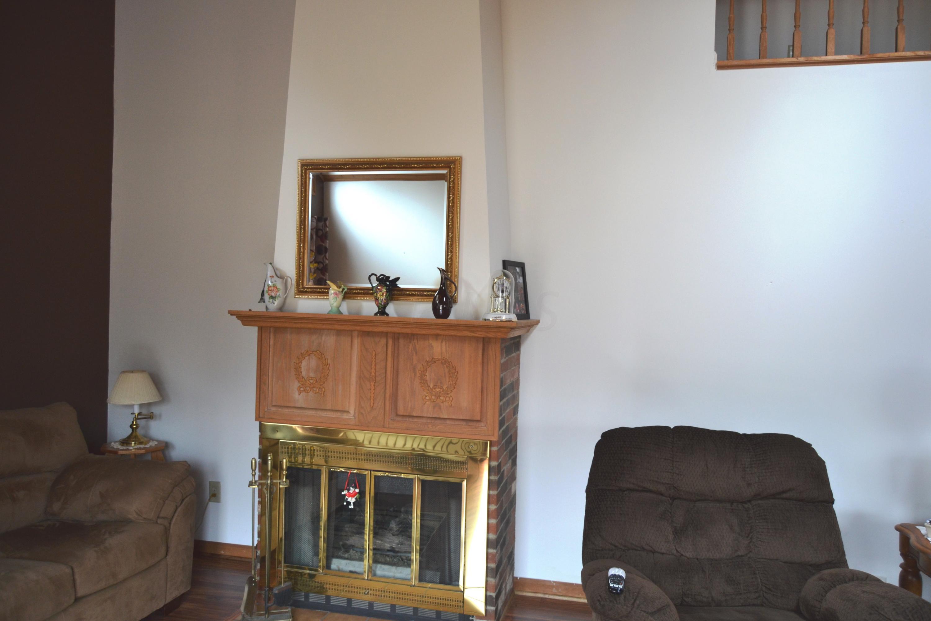 9000 Welsh Road Radnor, OH 43066 - Photo 7 of 28 2 sided fireplace between the great room and owner's suite.