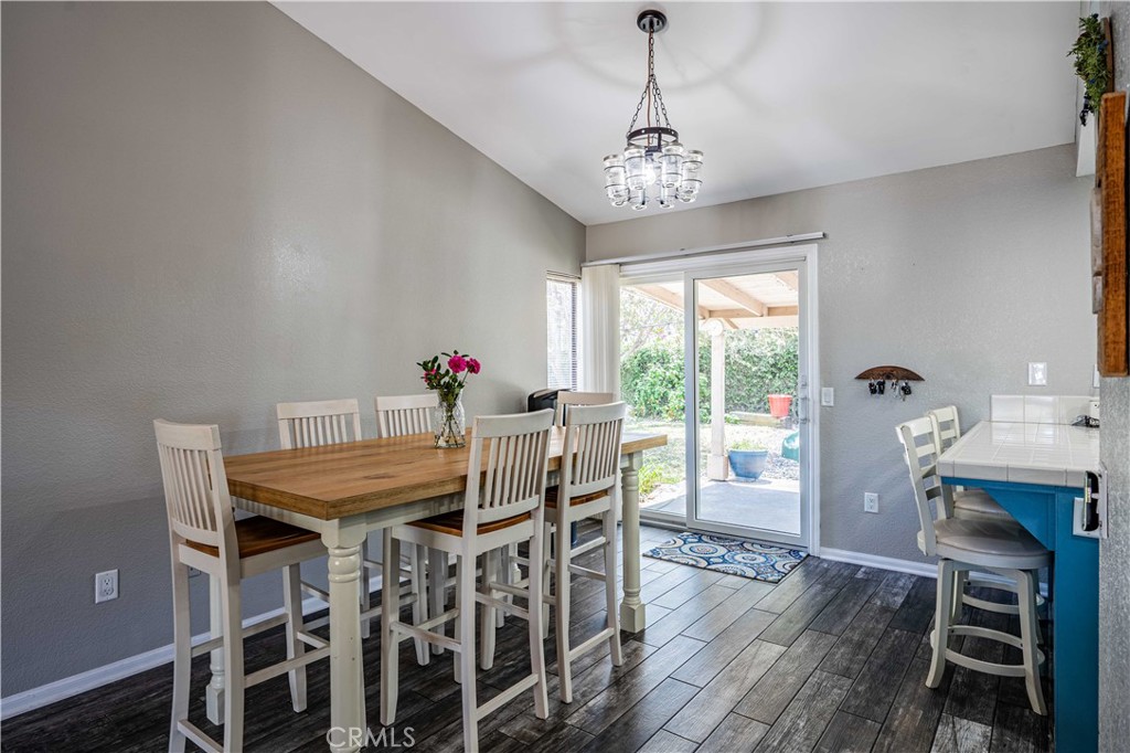 27571 Cabrillo Drive Menifee, CA 92586 - Photo 13 of 56 a view of a dining room with furniture window and wooden floor