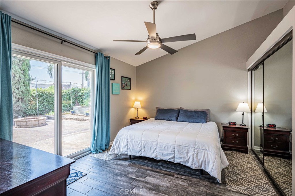 27571 Cabrillo Drive Menifee, CA 92586 - Photo 23 of 56 a bedroom with a bed and glass walk in closet