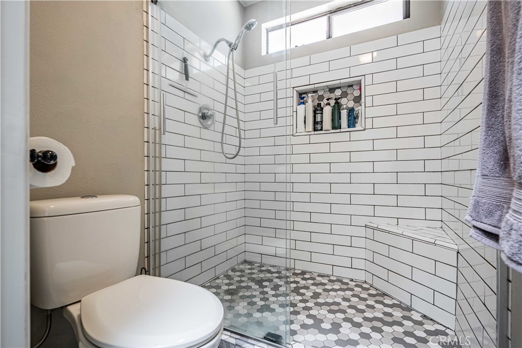 27571 Cabrillo Drive Menifee, CA 92586 - Photo 26 of 56 a bathroom with a toilet and a shower