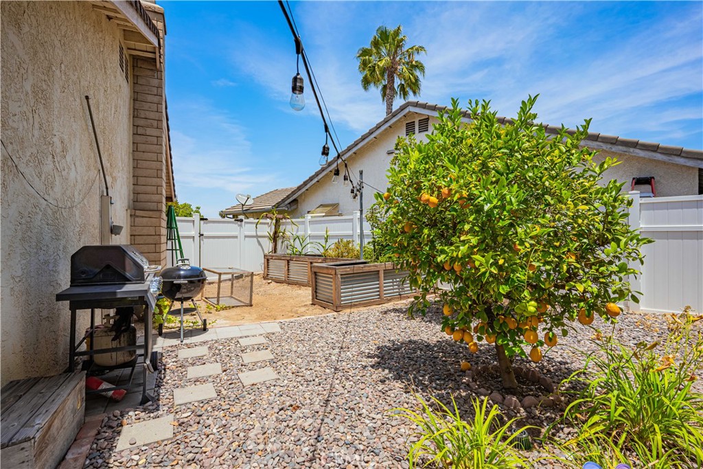 27571 Cabrillo Drive Menifee, CA 92586 - Photo 33 of 56 a roof deck with table and chairs and potted plants