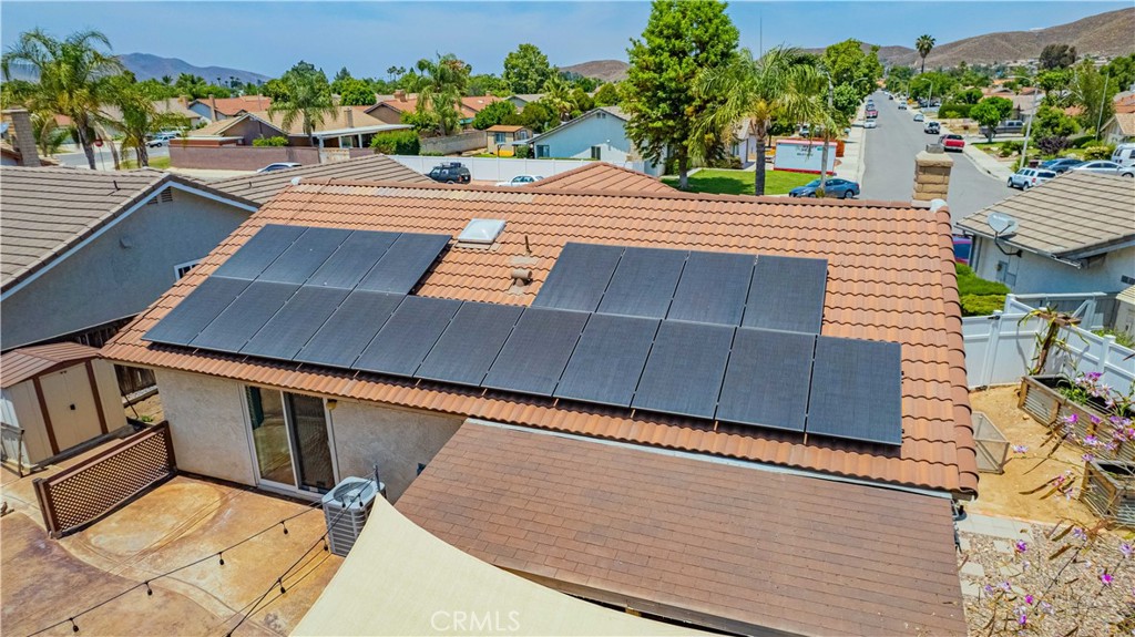 27571 Cabrillo Drive Menifee, CA 92586 - Photo 54 of 56 a view of a patio with table and chairs with potted plants